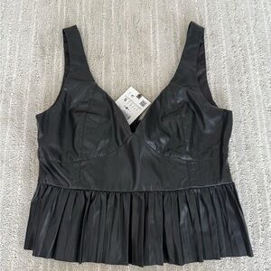 Peplum faux leather top